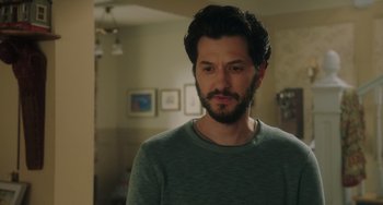 Movie still from “Flora & Ulysses” (2021), directed by Lena Khan – A person wearing a green shirt; Close Up shot, Over the shoulder angle