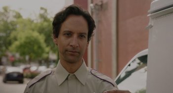 Movie still from “Flora & Ulysses” (2021), directed by Lena Khan – A person wearing a uniform; Close Up shot, Over the shoulder angle