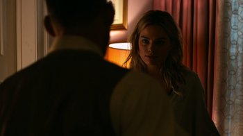 Movie still from “Focus” (2015), directed by John Requa – A man and a woman are looking at one another; Close Up shot, Over the shoulder angle