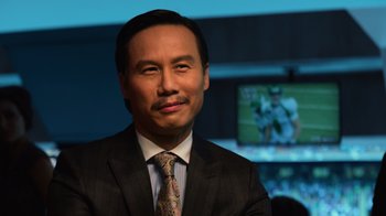 Movie still from “Focus” (2015), directed by John Requa – A person wearing a suit and tie; Close Up shot, Low angle