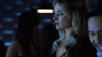 Movie still from “Focus” (2015), directed by John Requa – A woman with long blonde hair looking to her left; Close Up shot, Low angle