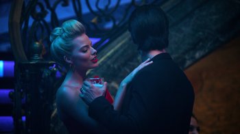 Movie still from “Focus” (2015), directed by John Requa – A man and a woman dancing in a dark room; Medium shot, Over the shoulder angle