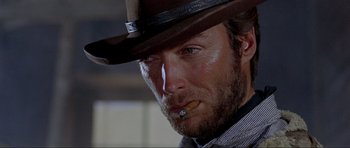 Movie still from “For a Few Dollars More” (1965), directed by Sergio Leone – A person wearing a cowboy hat; Close Up shot, Low angle