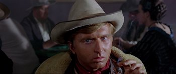 Movie still from “For a Few Dollars More” (1965), directed by Sergio Leone – A person wearing a cowboy hat; Close Up shot, Low angle