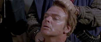 Movie still from “For a Few Dollars More” (1965), directed by Sergio Leone – A person getting his hair combed back; Close Up shot, Over the shoulder angle