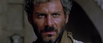 Movie still from “For a Few Dollars More” (1965), directed by Sergio Leone – A person with a beard; Close Up shot, Low angle