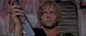 Movie still from “For a Few Dollars More” (1965), directed by Sergio Leone – A person holding a gun; Close Up shot, Low angle