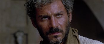 Movie still from “For a Few Dollars More” (1965), directed by Sergio Leone – A person with a beard; Close Up shot, Low angle