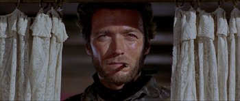 Movie still from “For a Few Dollars More” (1965), directed by Sergio Leone – A person with a cigarette in his mouth; Close Up shot, Low angle