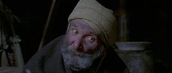 Movie still from “For a Few Dollars More” (1965), directed by Sergio Leone – An old man wearing a yellow hat and a beard; Close Up shot, Low angle