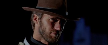 Movie still from “For a Few Dollars More” (1965), directed by Sergio Leone – A person wearing a hat; Close Up shot, Low angle