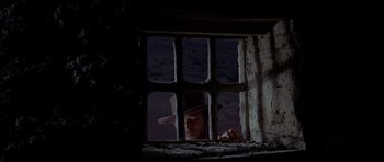 Movie still from “For a Few Dollars More” (1965), directed by Sergio Leone – A man looking out of a window at night; Close Up shot, Low angle