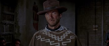 Movie still from “For a Few Dollars More” (1965), directed by Sergio Leone – A person wearing a hat; Close Up shot, Low angle