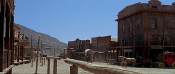 Movie still from “For a Few Dollars More” (1965), directed by Sergio Leone – An image of a western town in the middle of the day; Extreme Wide shot, Low angle