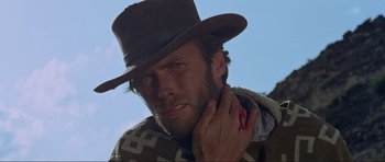 Movie still from “For a Few Dollars More” (1965), directed by Sergio Leone – A person wearing a cowboy hat; Close Up shot, Low angle