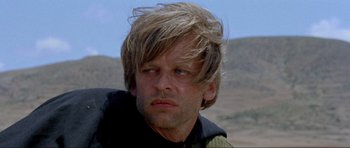 Movie still from “For a Few Dollars More” (1965), directed by Sergio Leone – A person wearing a jacket; Close Up shot, Low angle