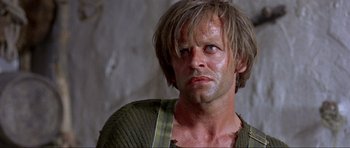 Movie still from “For a Few Dollars More” (1965), directed by Sergio Leone – A person wearing a sweater; Close Up shot, Low angle