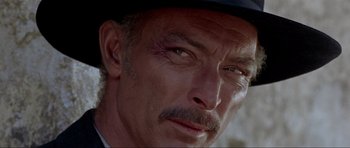 Movie still from “For a Few Dollars More” (1965), directed by Sergio Leone – A person wearing a hat; Close Up shot, Low angle