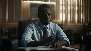Movie still from “Euphoria” (2019), created by Sam Levinson – A man sitting at a table in front of a window; Medium shot, Low angle