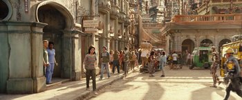 Movie still from “Alita: Battle Angel” (2019), directed by Robert Rodriguez – A group of people walking down a street; Wide shot, High angle