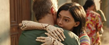 Movie still from “Alita: Battle Angel” (2019), directed by Robert Rodriguez – A man and a woman embracing each other; Close Up shot, Over the shoulder angle
