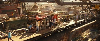Movie still from “Alita: Battle Angel” (2019), directed by Robert Rodriguez – A group of people standing on top of a train track; Wide shot, High angle