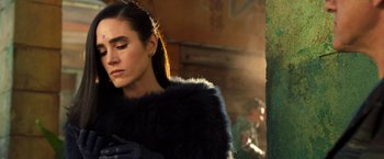 Movie still from “Alita: Battle Angel” (2019), directed by Robert Rodriguez – A woman in a black fur coat and black leather gloves; Close Up shot, Low angle