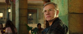 Movie still from “Alita: Battle Angel” (2019), directed by Robert Rodriguez – A person wearing glasses; Close Up shot, Low angle