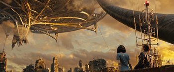 Movie still from “Alita: Battle Angel” (2019), directed by Robert Rodriguez – A woman standing in front of an alien ship; Extreme Wide shot, Low angle