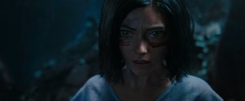 Movie still from “Alita: Battle Angel” (2019), directed by Robert Rodriguez – A person with a face paint; Close Up shot, High angle