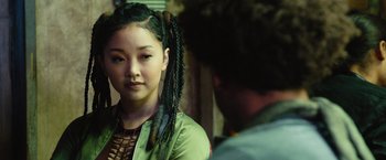 Movie still from “Alita: Battle Angel” (2019), directed by Robert Rodriguez – A young woman with long black hair in front of a man; Close Up shot, Over the shoulder angle