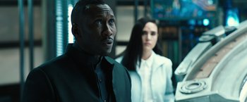 Movie still from “Alita: Battle Angel” (2019), directed by Robert Rodriguez – A man and a woman are standing in a room together; Close Up shot, Over the shoulder angle