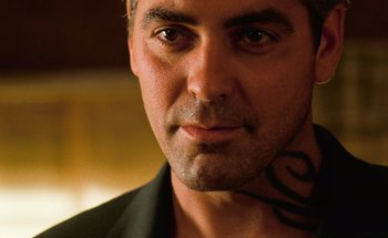 Movie still from “From Dusk Till Dawn” (1996), directed by Robert Rodriguez – A person with a tattoo on his neck; Close Up shot, Low angle