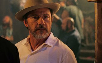 Movie still from “From Dusk Till Dawn” (1996), directed by Robert Rodriguez – A person wearing a hat; Close Up shot, Over the shoulder angle