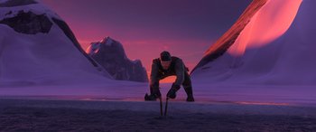 Movie still from “Frozen” (2013), directed by Jennifer Lee – A man is bending over in the middle of the snow; Wide shot, High angle