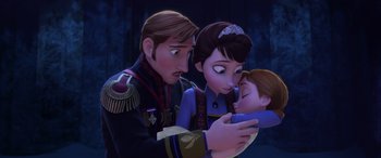 Movie still from “Frozen” (2013), directed by Jennifer Lee – A couple of people that are looking at a baby; Medium shot, Low angle