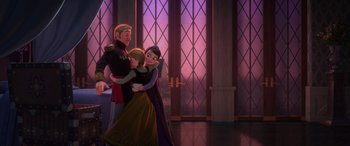 Movie still from “Frozen” (2013), directed by Jennifer Lee – A couple of people standing next to each other in front of a window; Wide shot, Over the shoulder angle