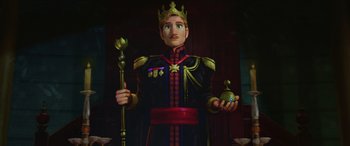 Movie still from “Frozen” (2013), directed by Jennifer Lee – A statue of a man dressed as a king holding a scepter; Medium shot, Low angle