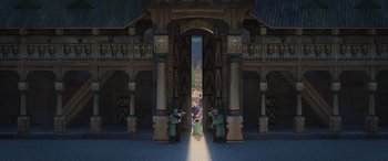 Movie still from “Frozen” (2013), directed by Jennifer Lee – A group of people standing in front of an archway; Extreme Wide shot, Low angle
