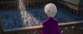 Movie still from “Frozen” (2013), directed by Jennifer Lee – A woman in a purple dress looking out over a crowd of people; Wide shot, Over the shoulder angle