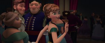 Movie still from “Frozen” (2013), directed by Jennifer Lee – A woman in a green and black dress standing next to a man in a blue suit; Medium shot, Over the shoulder angle