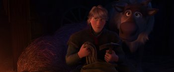 Movie still from “Frozen” (2013), directed by Jennifer Lee – A young man holding a hammer and a rope; Close Up shot, Over the shoulder angle