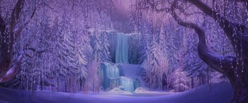 Movie still from “Frozen” (2013), directed by Jennifer Lee – An icy waterfall surrounded by snow covered trees; Extreme Wide shot, Low angle