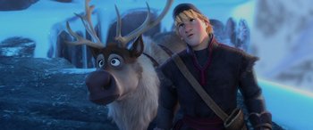 Movie still from “Frozen” (2013), directed by Jennifer Lee – A man standing next to an animal with horns on it; Medium shot, Over the shoulder angle