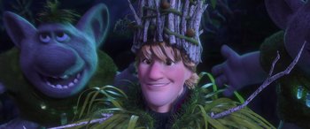 Movie still from “Frozen” (2013), directed by Jennifer Lee – A woman wearing a hat made out of branches; Close Up shot, Low angle