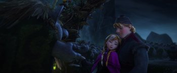 Movie still from “Frozen” (2013), directed by Jennifer Lee – A couple of people standing next to each other in a forest; Medium shot, Low angle