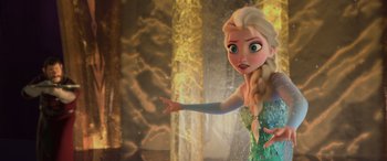 Movie still from “Frozen” (2013), directed by Jennifer Lee – A woman in a green dress is pointing to the side; Medium shot, Over the shoulder angle
