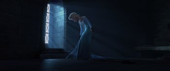 Movie still from “Frozen” (2013), directed by Jennifer Lee – A woman in a blue dress is chained to a wall; Wide shot, Low angle
