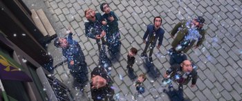 Movie still from “Frozen” (2013), directed by Jennifer Lee – A group of people standing on top of a brick road; Wide shot, Overhead angle