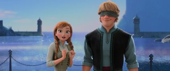 Movie still from “Frozen” (2013), directed by Jennifer Lee – A woman standing next to a blindfolded man; Medium shot, Over the shoulder angle